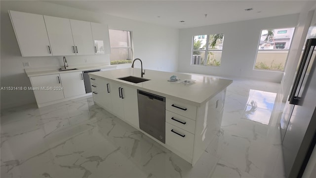 kitchen with a center island with sink, dishwasher, sink, and light tile floors