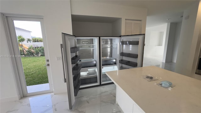 kitchen featuring light tile floors