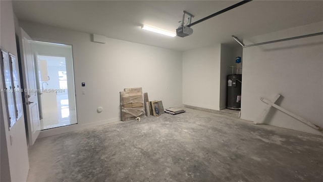 garage featuring water heater and a garage door opener