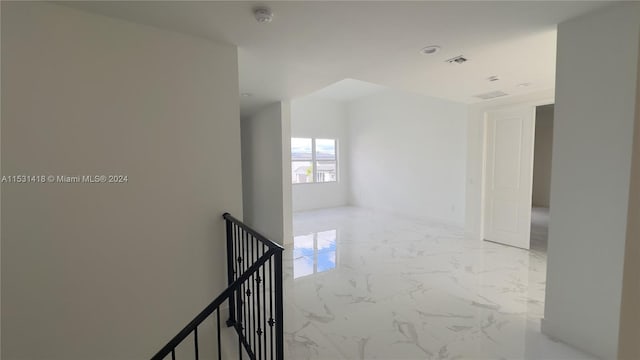 hallway with light tile floors