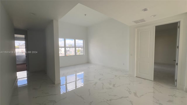 empty room featuring light tile floors