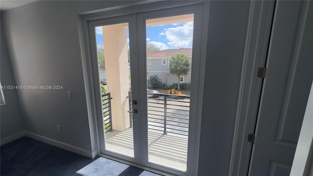 doorway with dark carpet