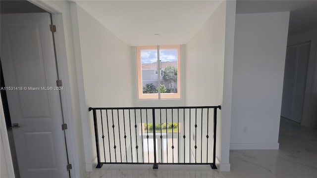 hallway with tile floors