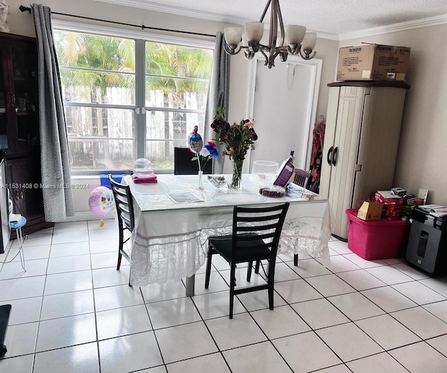 tiled dining area featuring ornamental molding and an inviting chandelier