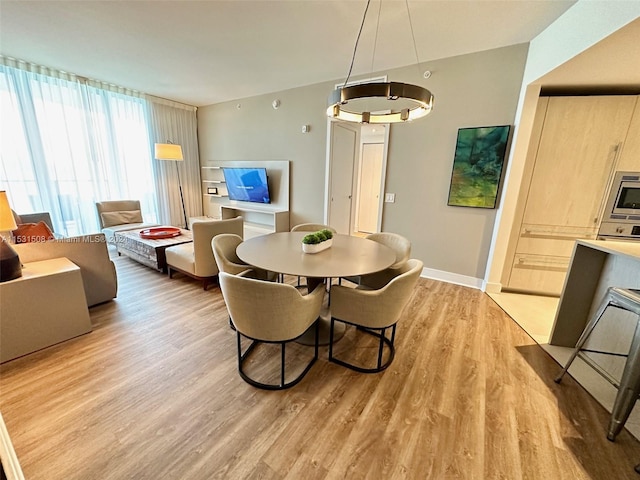 dining space featuring light hardwood / wood-style floors