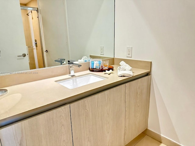 bathroom with tile floors and dual vanity