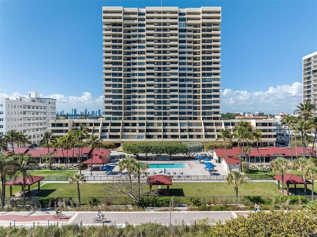 view of building exterior with a community pool