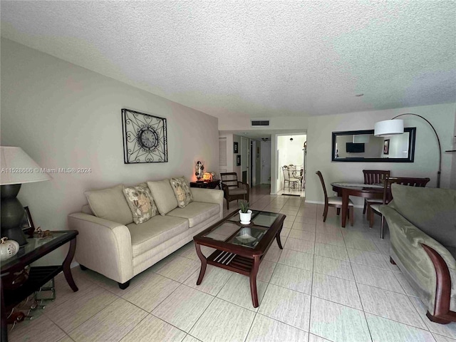 living room with a textured ceiling