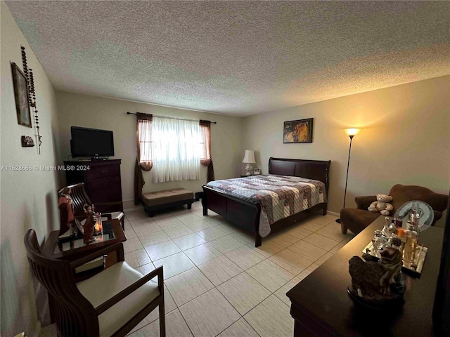 2061 NW 47th Ter Unit 312, Lauderhill, FL 33313 - bedroom featuring a textured ceiling and light tile patterned flooring