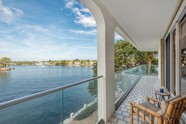 balcony featuring a water view