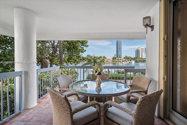 balcony featuring a water view