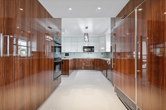 kitchen with light stone countertops, white cabinetry, backsplash, black appliances, and light tile floors