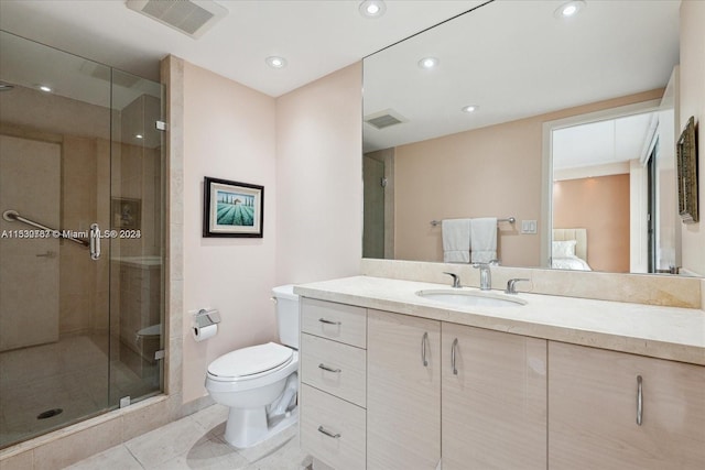 bathroom with toilet, a shower with door, tile flooring, and vanity