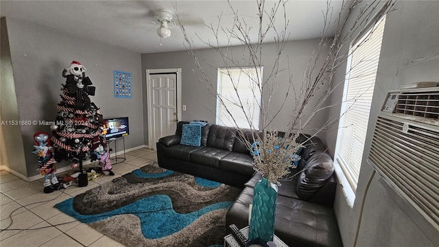 living room featuring light tile floors and ceiling fan