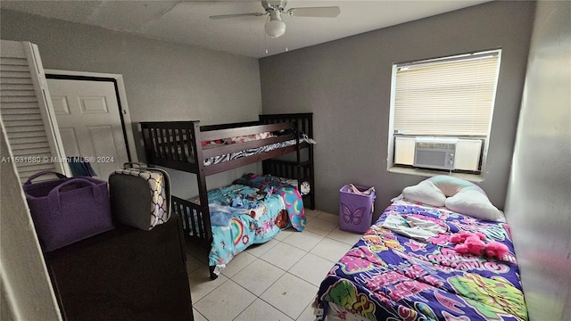 bedroom with light tile floors and ceiling fan