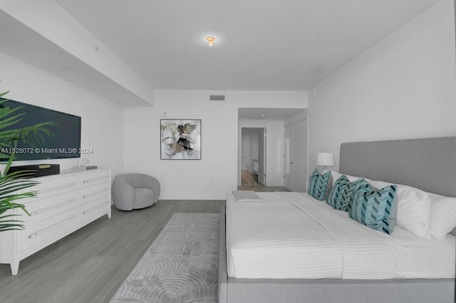 bedroom featuring hardwood / wood-style flooring