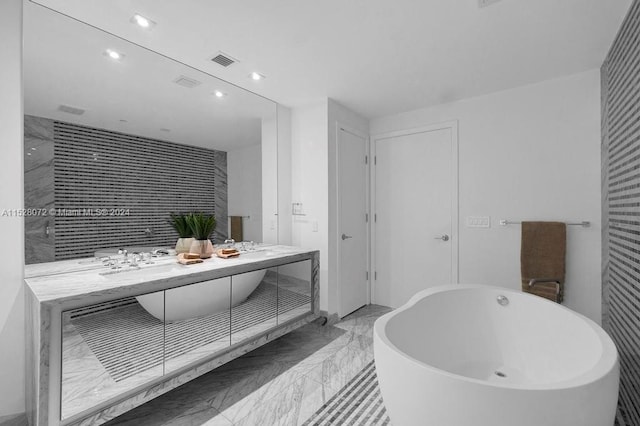 bathroom featuring a bathing tub, double vanity, and tile floors