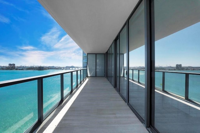 balcony featuring a water view