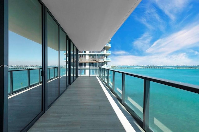 balcony featuring a water view