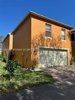 view of property exterior with a garage