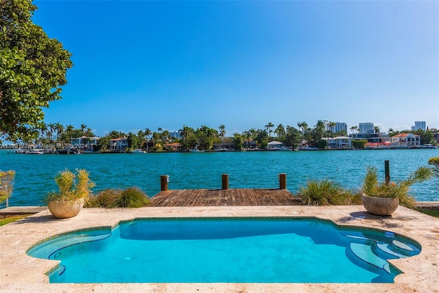 view of pool with a water view