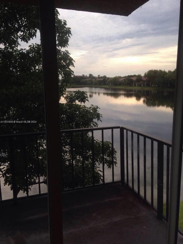 balcony at dusk with a water view