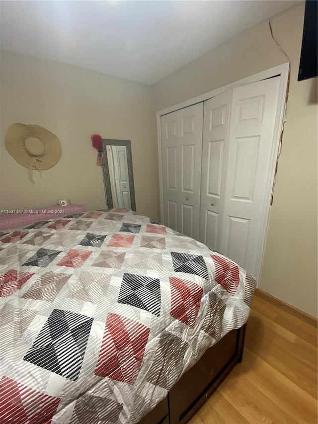 bedroom featuring a closet and light hardwood / wood-style flooring