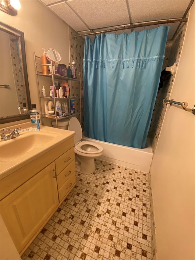 full bathroom featuring shower / bath combo with shower curtain, toilet, tile flooring, and vanity