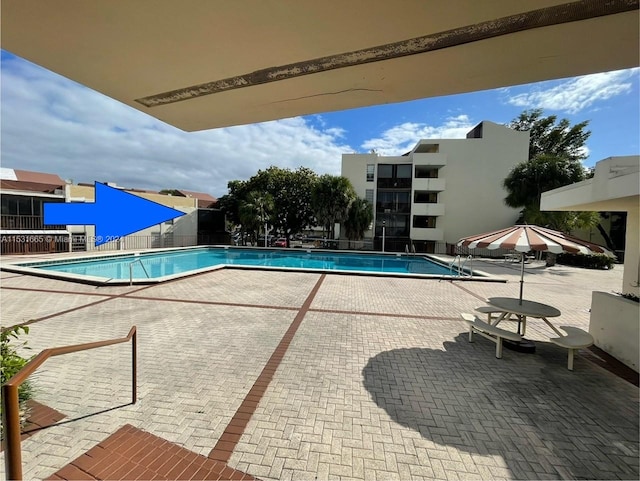 view of swimming pool with a patio area