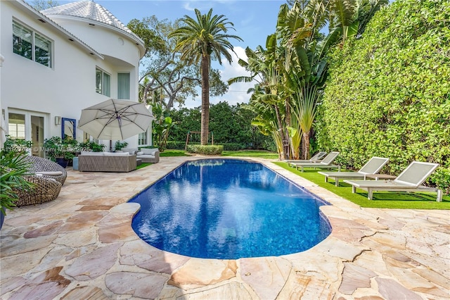 view of pool featuring an outdoor hangout area and a patio