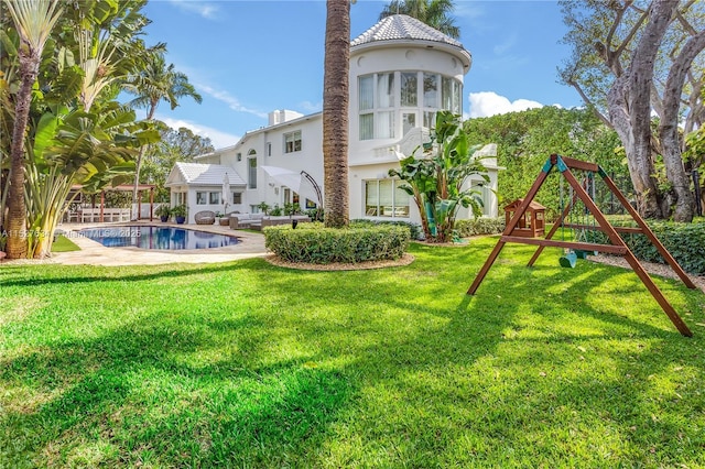 view of yard with an outdoor hangout area and a playground