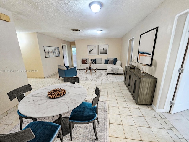 6990 SW 1st St, Margate, FL 33068 - tiled dining room featuring a textured ceiling