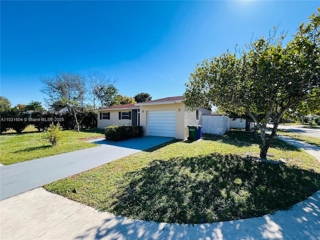 single story home featuring a front lawn and a garage