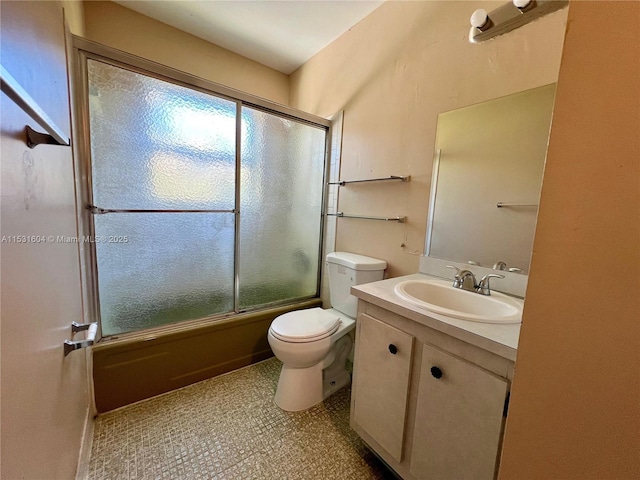 full bathroom with vanity, toilet, and shower / bath combination with glass door