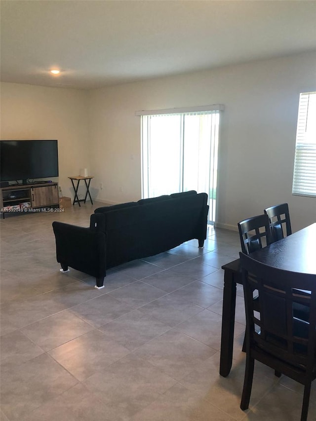 living room featuring light tile floors