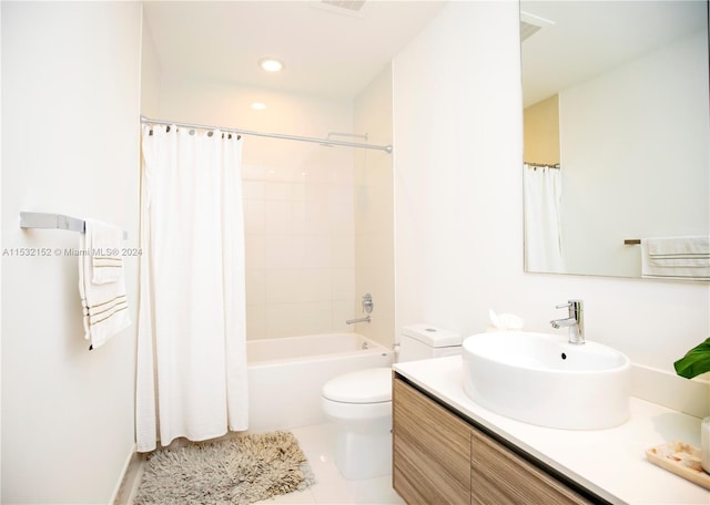 full bathroom featuring toilet, shower / tub combo with curtain, tile floors, and vanity