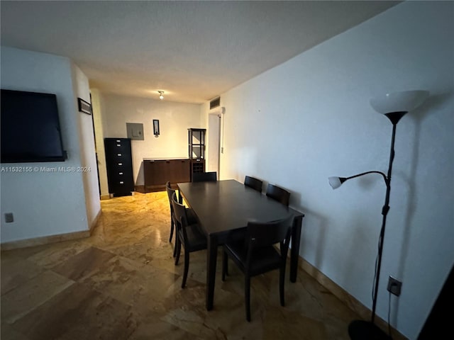 dining area featuring electric panel