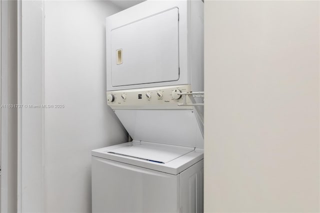 laundry area with stacked washer / dryer