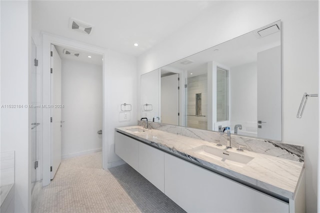 bathroom with tile flooring and dual vanity