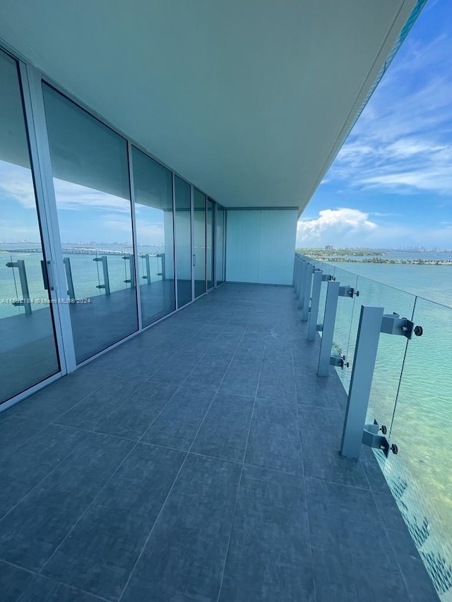 balcony featuring a water view