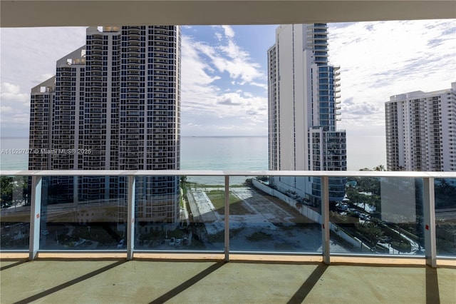 balcony featuring a water view