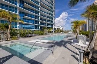 view of swimming pool featuring a patio area