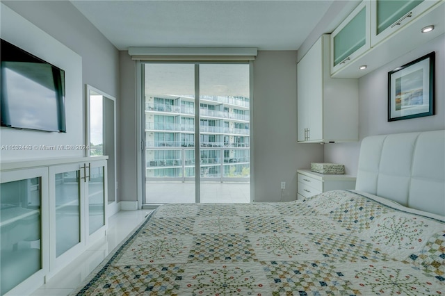 tiled bedroom featuring access to exterior