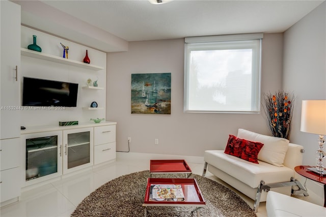 living room featuring light tile floors