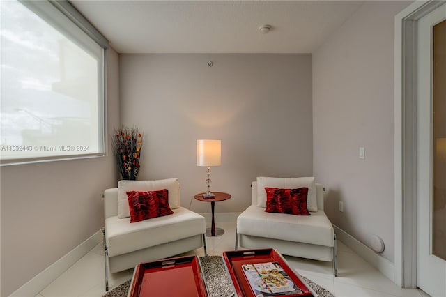 sitting room with light tile floors