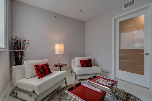 living area featuring light tile floors