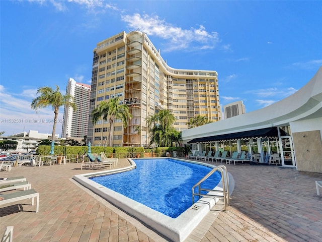 view of swimming pool featuring a patio area