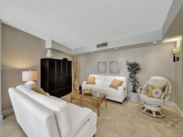 tiled living room with a textured ceiling