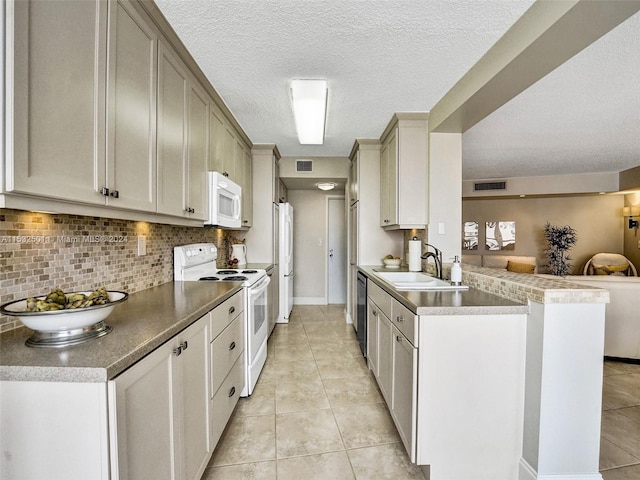 kitchen featuring kitchen peninsula, backsplash, white appliances, sink, and light tile floors