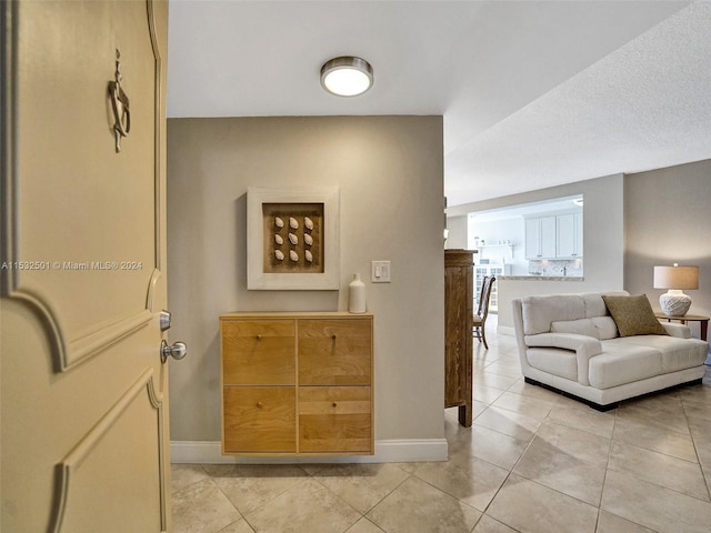 living room featuring light tile floors